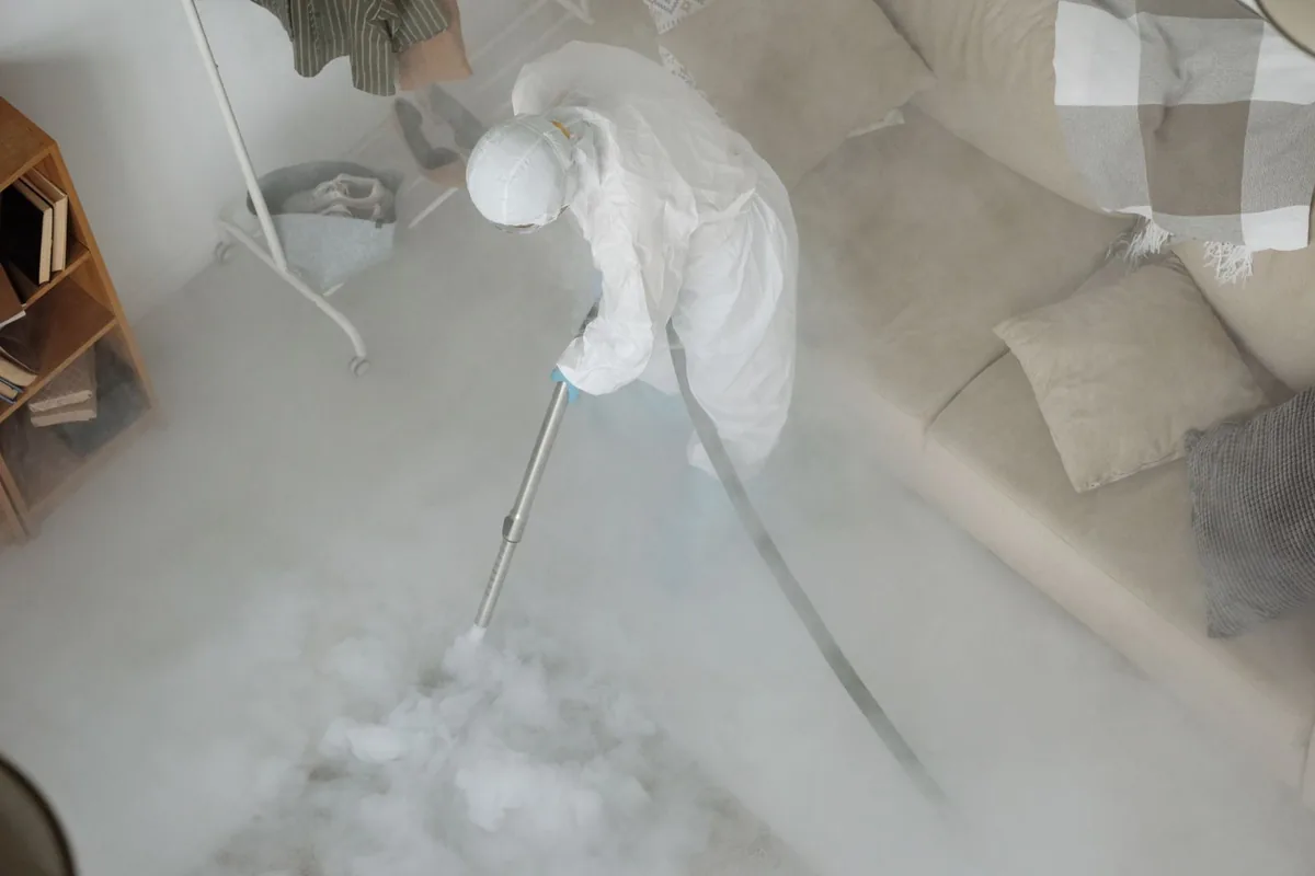 Biohazard cleanup technician in protective equipment, South Acres / Crestmont Park, Houston, TX